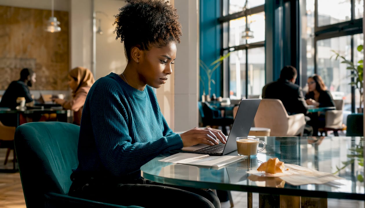 Freelancer working at home desk in morning light