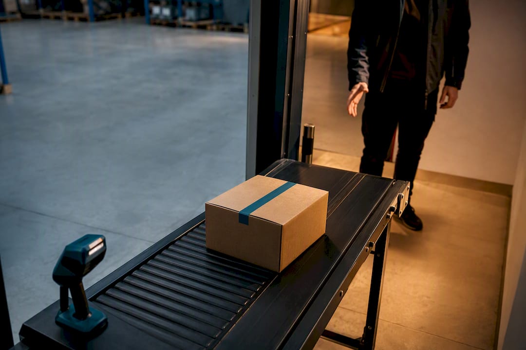 Fulfillment carton moving toward courier collection